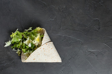 Lavash with herbs with olive oil and spices on a dark background