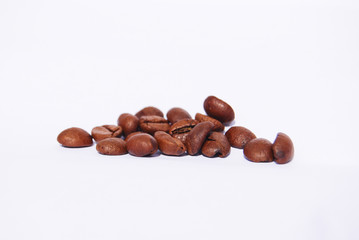 Fried coffee beans small group, lie on a white background