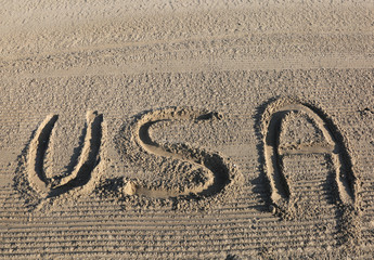 big WORD USA United States of America on the sand of the beach