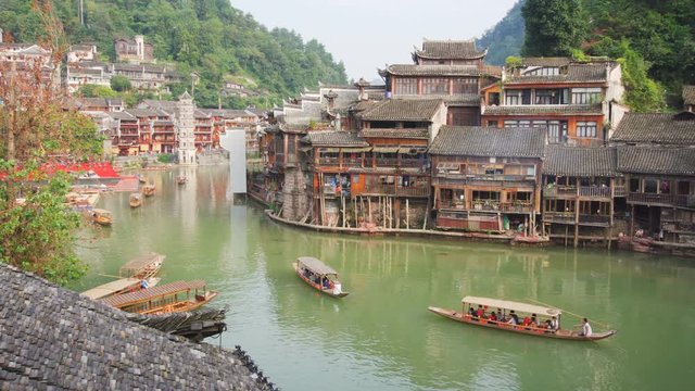 Traditional Chinese wooden tourist boats in Fenghuang County