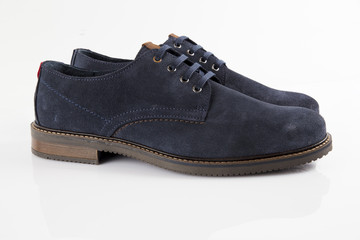 Male blue leather shoe on white background, isolated product, comfortable footwear.