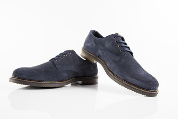 Male blue leather shoe on white background, isolated product, comfortable footwear.