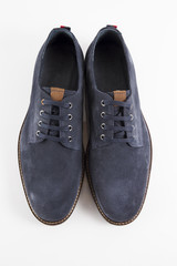 Male blue leather shoe on white background, isolated product, comfortable footwear.