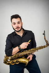 Naklejka premium Saxophone Player Saxophonist with Sax