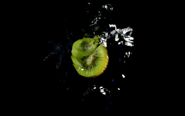 fruits in water on black backround