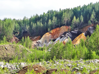 Bright dumps of the Lipovsky quarry. Sverdlovsk region. Russia