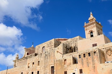 Fototapeta na wymiar View of part of the citadel and Cathedral tower, Rabat, Gozo, Malta.