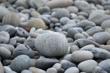 Fototapeta na wymiar Pebbles on the sea. Rest on the coast
