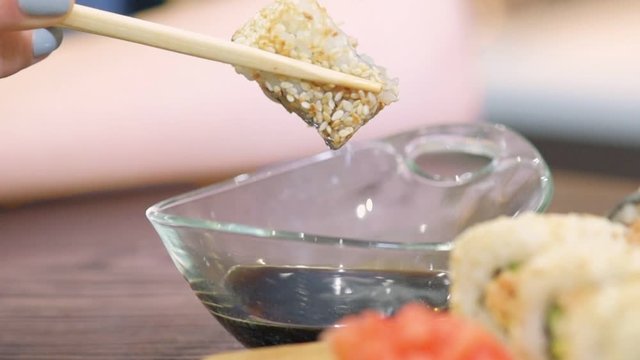 Cinemagraph - Soy sauce dripping from sushi . Motion Photo.