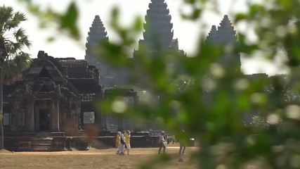 Dolly across the grounds of Angkor Wat to reveal the largest temples of Angkor.