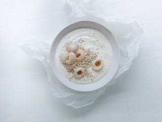 white yoghurt bowl with litchi and chia seeds
