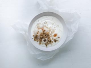 white yoghurt bowl with litchi and chia seeds