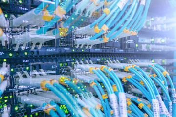 Fiber Optical connector interface. Fiber cable serve with technology style against fiber optic background. Severs computer in a rack at the large data center. has a small noise.