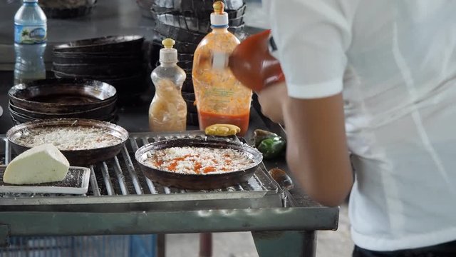 Restaurant worker preparing food in Santiago De Cuba