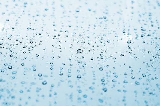 Water Drops Are On Light Blue Glass