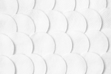 Cotton pads pattern. White abstract background. Flat lay. Beauty, spa, body care.