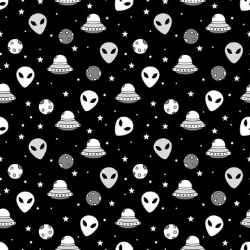 Monochrome space themed seamless pattern with alien face and ships