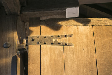 Brown background with detail of Japanese traditional wooden door in Kyoto, Japan.
