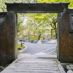 Detail of old gates with trees in autumn in historical district in Kyoto, Japan © abyrvalg_00