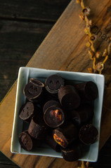 Fototapeta na wymiar Vegan chocolate candies with emoji faces