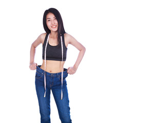 weight loss woman wearing her old jeans and measure tape isolated on white background