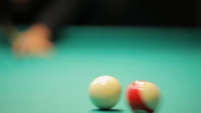 Billiards, concentrated young woman playing in club