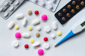 Top view of the pills on the white background, Pack of tablet drug and capsule pills on the floor, Pile of the drug and pills on the white background.