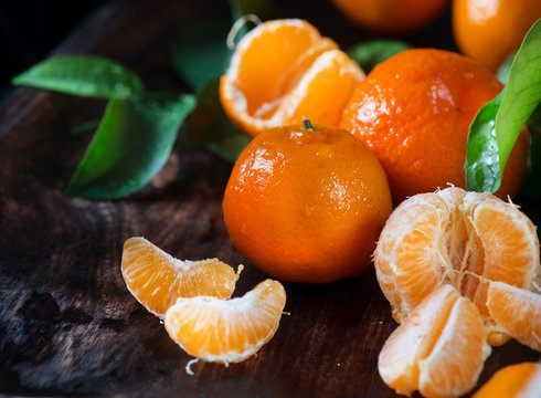 Tangerines. Fresh organic ripe mandarines closeup on wooden table. Top view