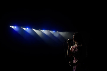 Shadow of singer in light
