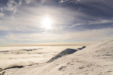peaks of mountains above the clouds