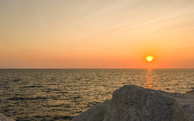 Beautiful sunset on the rock beach