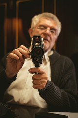 Senior Man Holding Video Camera