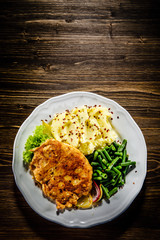 Fried pork chop, mashed potatoes and green beans