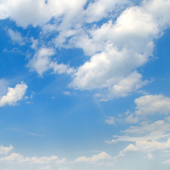 cumulus clouds in the blue sky