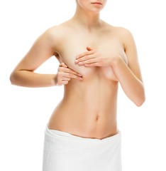 Fototapeta premium Woman examining breast isolated on white background