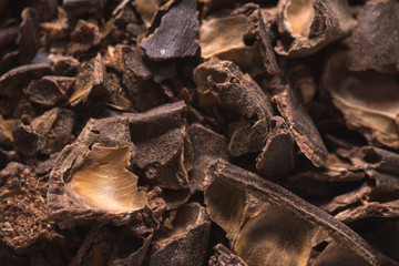Smashed carob pods