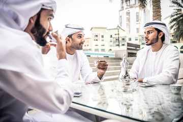 Arabian businessmen meeting outdoors