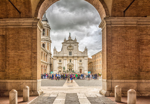 Sanctuary of the Holy House of Loreto, Marches, Italy, the Basilica facade with the Sisto V monument in the foreground
