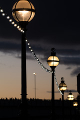 Fototapeta na wymiar Street lights at night, old fashioned style street lamps