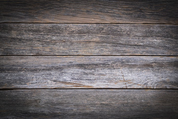 A rustic wooden background made of weathered boards