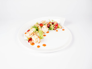 Starter: Mix salads, baked goat cheese, sea-buckthorn jam, caramelized pear with thyme, plum and roast nuts - on a white background
