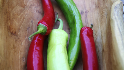 Peppers on wooden background