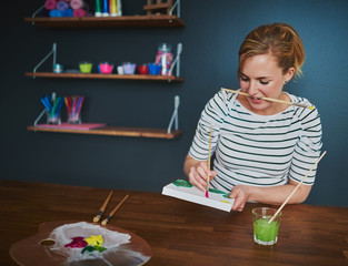 Woman making a painting