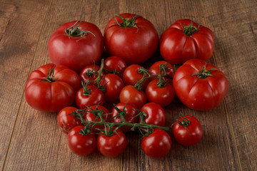 Tomatoes on the wooden background