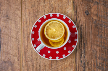 cup of tea on vintage wooden background