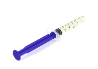 Isolated syringe with medicine on white