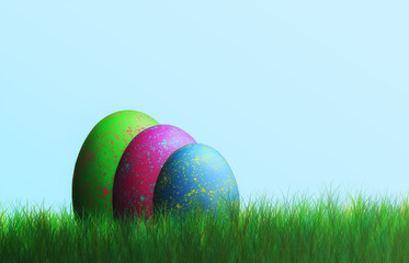 Colorful eggs in the grass at Easter, blue background