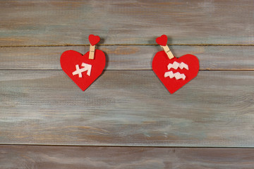 Sagittarius and Aquarius. signs of the zodiac and heart. wooden