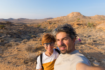 Couple selfie in the desert, Namib Naukluft National Park, Namibia road trip, travel destination in Africa.