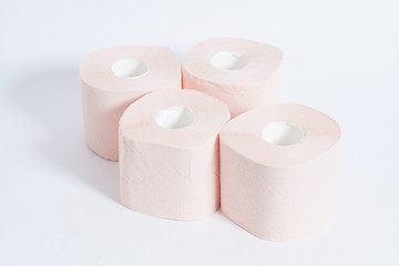 Pink toilet paper on white background